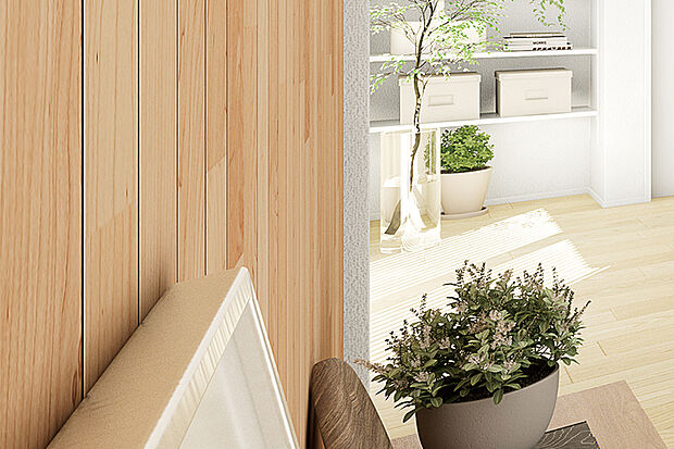 【【朝日ウッドテック/the wall】】リビングの一角に、天然木ならではの存在感を放つウッドパネルを採用しました。木の温もりに包まれるモダンな空間を演出します。※号棟により採用状況が異なります。