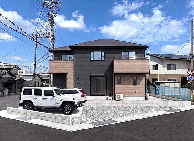 【外観完成イメージ】建物の形状に合わせて3色の外壁をバランス良く張り分けた、重厚感のある落ち着いた印象の外観デザインです。※現地写真に完成イメージ画像を合成したものです。
