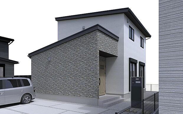 白を基調としたモダンな壁面に対し、玄関ポーチ部分に施された石目調のアクセントウォールが目を惹くNo.2区画。片流れ屋根がシャープな印象を加え、デザイン性の高さを際立たせています。