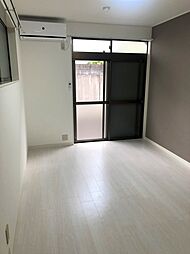 ポルシェ聖蹟桜ヶ丘II 207 2階ワンルームのリビング/ダイニング