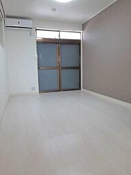 ポルシェ聖蹟桜ヶ丘II 207 2階ワンルームのリビング/ダイニング