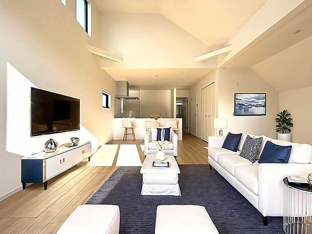 ご家族の写真や季節の花が映える、明るい色合いのフローリングが採用されたLDKです。CG加工済み