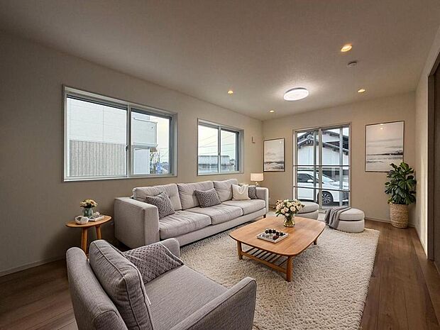 大きな窓のある開放感のあるリビングスペース。ご家族が集まる心地よい空間です。※CG加工済