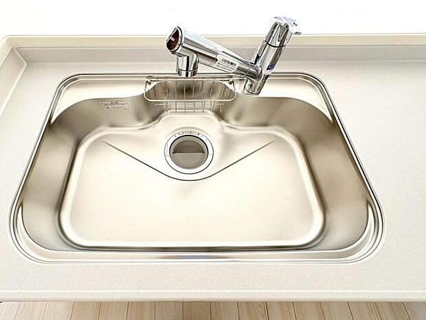 作業しやすい大きめのシンクは水はねの音や食器が当たる音を軽減する静音仕様。