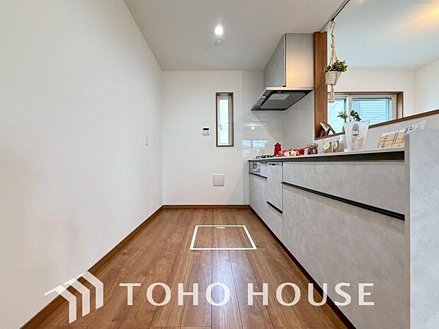 美しく使いやすいキッチン空間。優しい温もりを醸し出すキッチンは料理の為の配慮を随所に注ぎました。