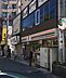 周辺：セブンイレブン 久喜駅西口店（898m）