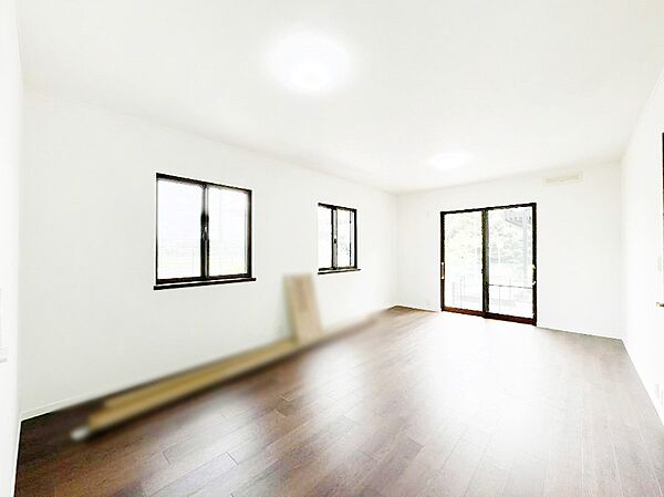 明るい陽光が注ぎ、寛ぎの雰囲気に満たされるリビングダイニング