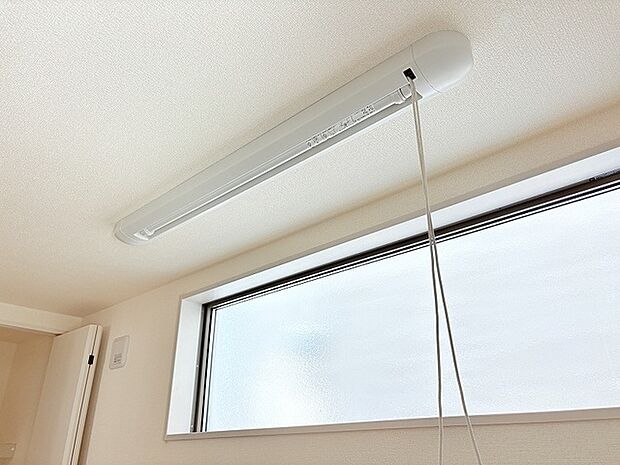 5.2帖洋室に室内物干しを設置してあります。