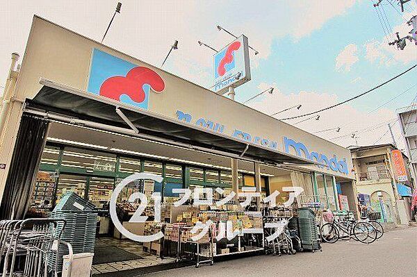 万代花園店 徒歩2分。 110m