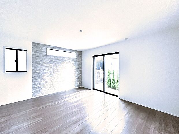 大きな窓からたっぷりの陽光と風を感じられるリビング