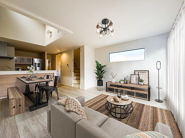 1号棟【LDK】光と風が満ちる吹き抜け仕様。 家族が集まるリビングは、圧倒的な広さに加え、吹き抜けを採用。明るい光が差し込み、リビングと2階の子供部屋を繋ぐ「家族の一体感」を生み出します