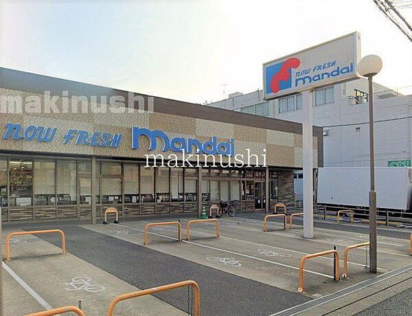 万代天美店 徒歩7分。 560m