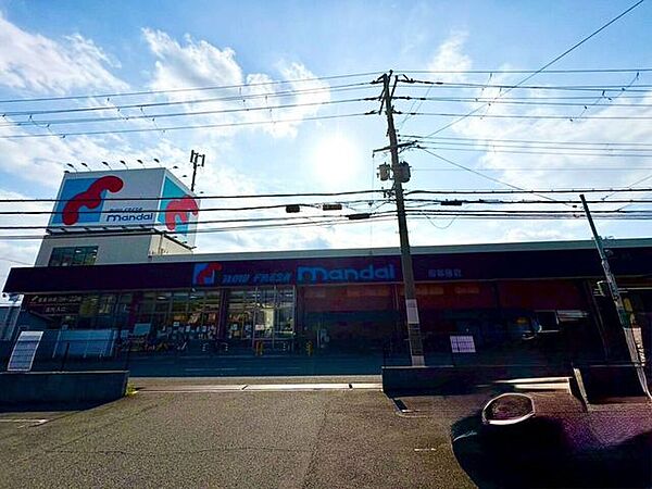 万代堺草部店 1140m