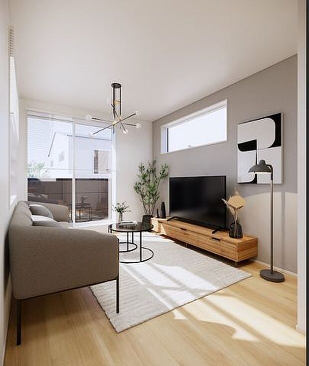 大きな窓から光が入る開放的なリビング。バルコニーとつながる心地よい空間です。