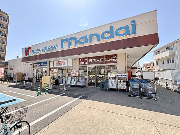 万代加納店 620m