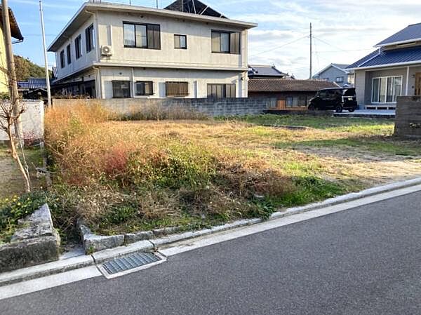 北西から