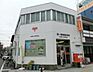 周辺：港八幡屋郵便局まで810m