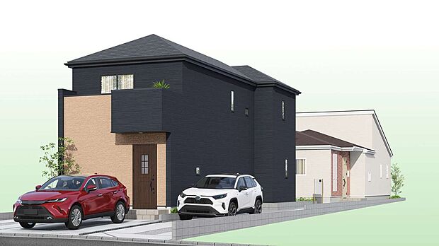 黒い外壁の2階建て住宅と敷地内の駐車スペース