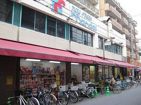 万代塚本店まで535m