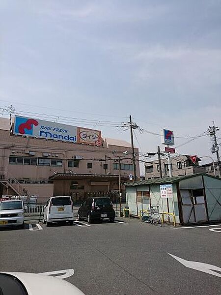 万代 寝屋川西店まで1207m