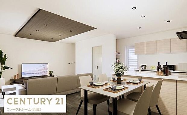 明るく開放感のあるリビングが印象的です。天井のアクセントが空間を引き締めナチュラルな色合いのインテリアが調和しています。キッチンとのつながりも感じられ使い勝手の良い設計となっています。