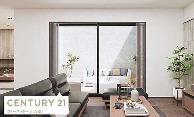 シンプルで落ち着いた配色のリビングが空間をすっきりと見せています。大きな窓から光が差し込み明るい雰囲気を感じられます。グリーンがアクセントとなり心地よい印象です。