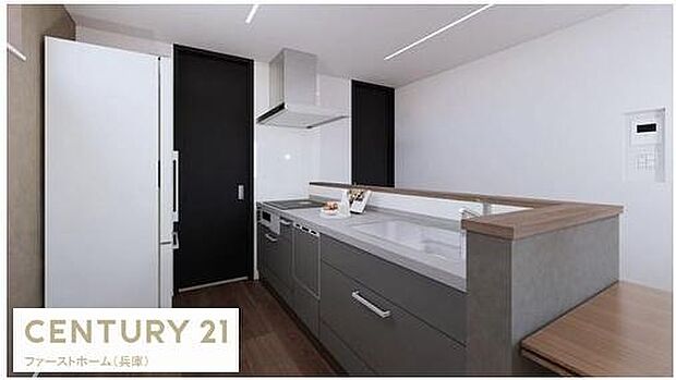 モダンなデザインが目を引くキッチンです。収納スペースが豊富で整理整頓しやすい印象です。作業スペースも広々としており日々の家事も快適にこなせそうです。清潔感のある配色も魅力的です。