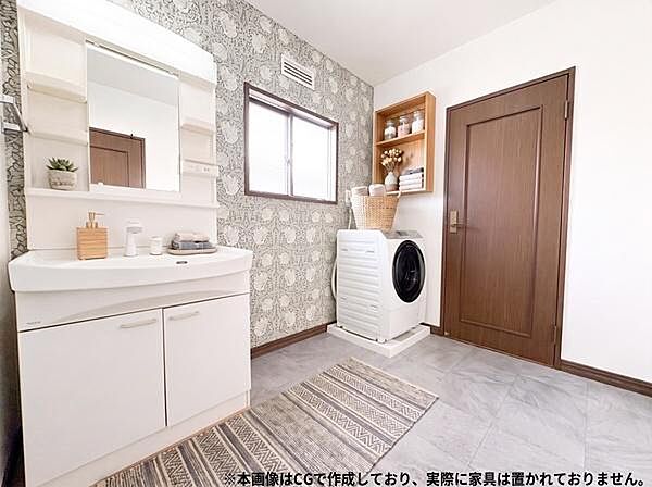 広々とした洗面室空間は明るい印象。壁のデザインが印象的です。床は落ち着いた色合いで全体的にまとまりがある空間です。