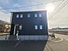 外観：爽やかな青空の下、静かに佇むモダンな住まい