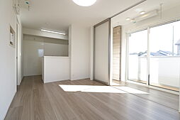 にゅうまごびれっじIII　A棟 103 1階1LDKのリビング/ダイニング