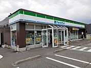 【コンビニエンスストア】ファミリーマート　魚津吉島店まで1615ｍ